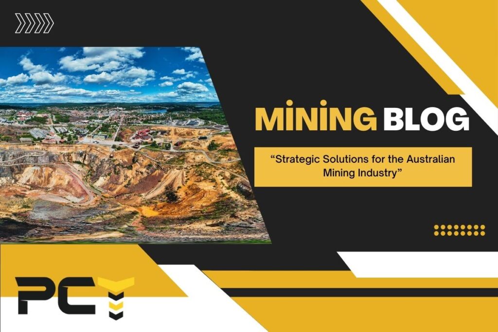 An aerial view of a remote Australian mine site with a single, durable core tray placed prominently in the foreground.